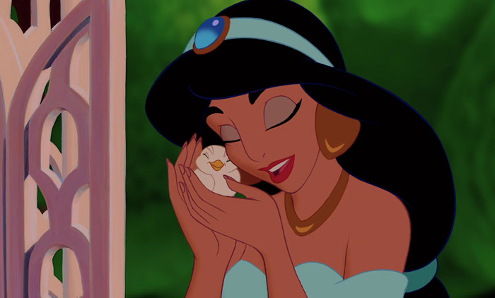 Jasmine looking happy while holding a bird 