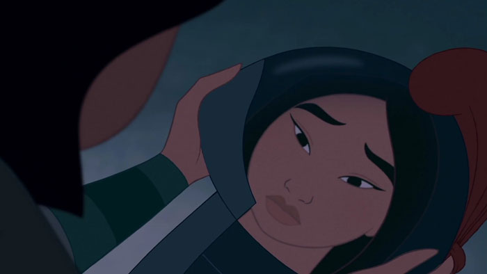 Mulan looking sad while staring at herself in the mirror