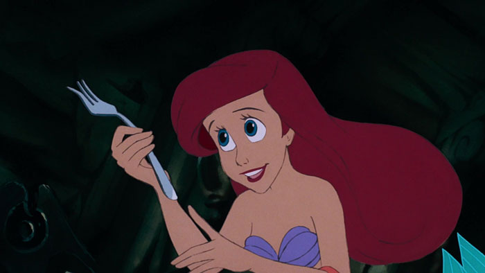 Ariel holding a fork 