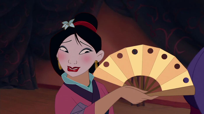 Dressed as geisha Mulan smiling 