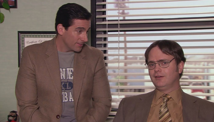 Micheal scott looking at Dwight Schrute, that's talking with a proud look