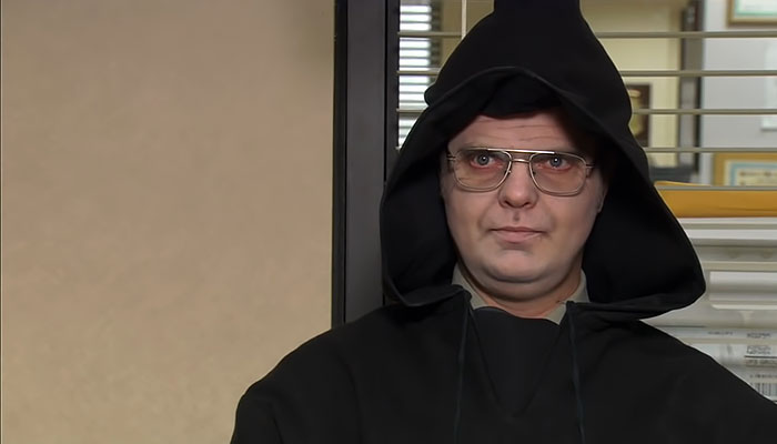 Dwight Schrute in a grim reaper suit in the interview room