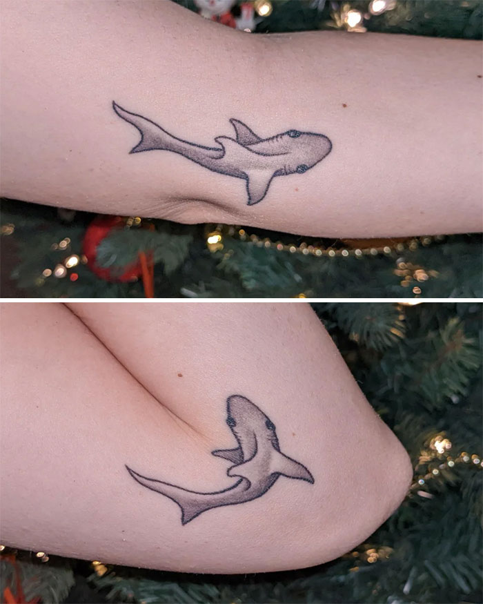 Swimming shark elbow tattoo