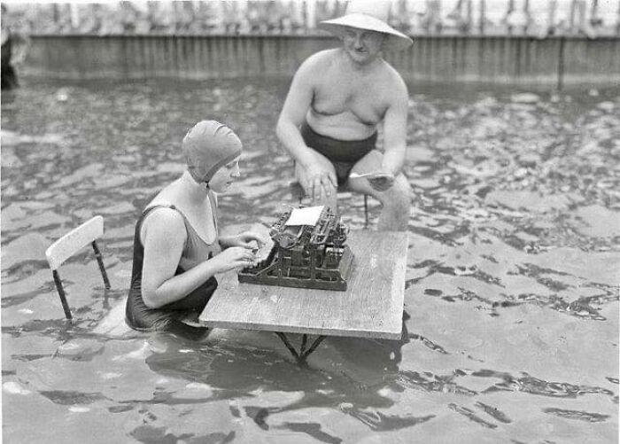 A Businessman And Secretary Working In A Pool During A Heatwave In Berlin, Germany, 1926