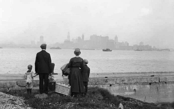 An Immigrant Family Looking At Manhattan From The Dock At Ellis Island. August 13, 1925