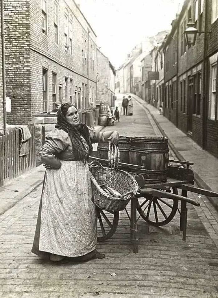 Woman Selling Fish From A Barrel, 1910