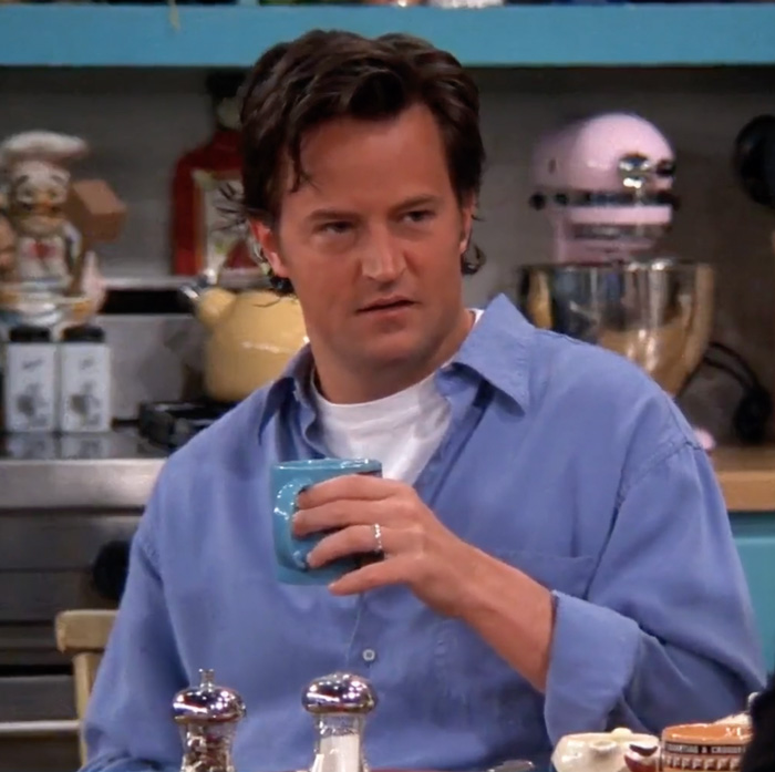 Chandler wearing blue shirt and white t-shirt 