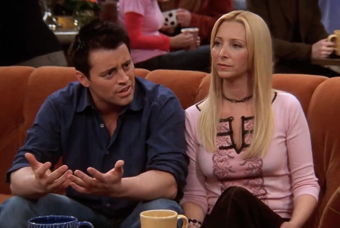 Joey and Phoebe sitting on the couch 