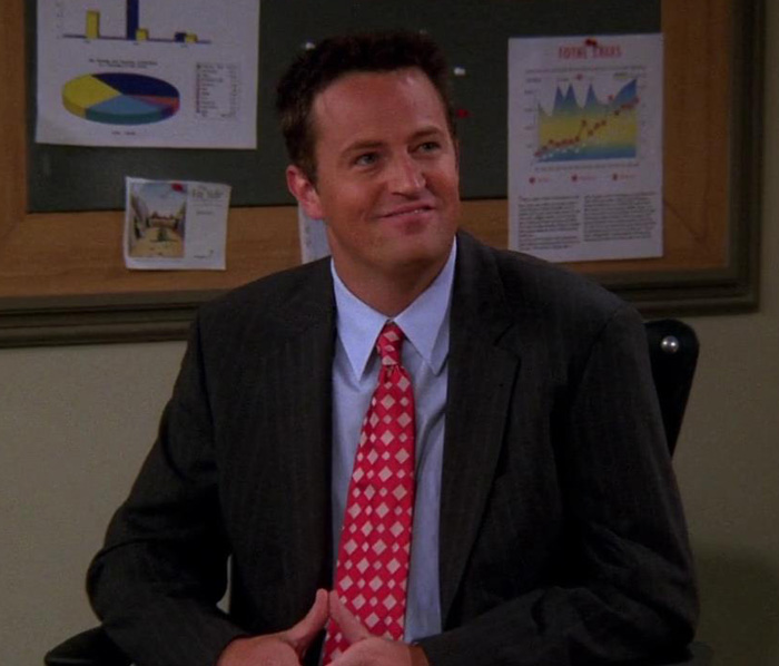 Chandler wearing suite and smiling 
