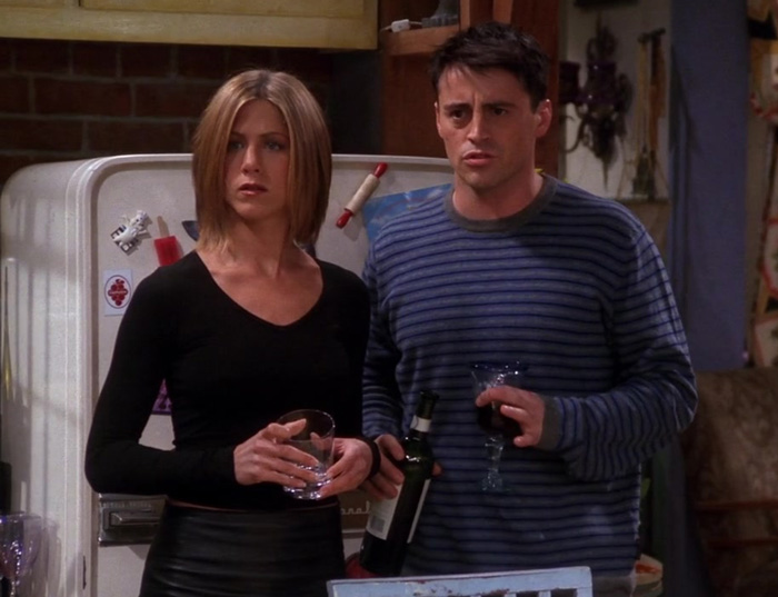 Rachel and Joey holding glasses 