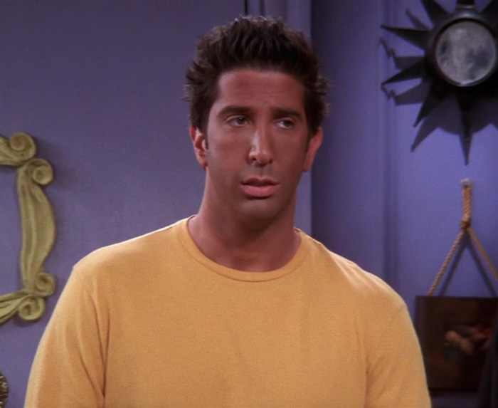 Tanned Ross wearing yellow sweater 