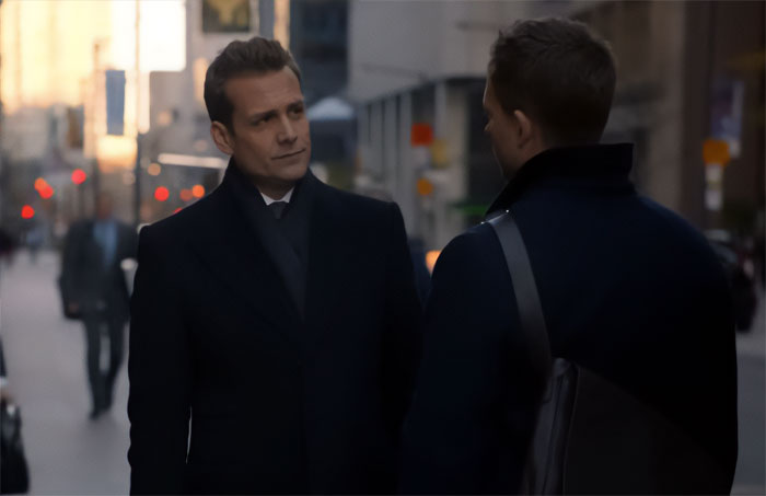 Harvey Specter standing on the street and talking