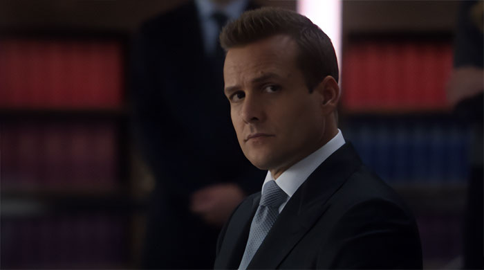 Harvey Specter looking thoughtful