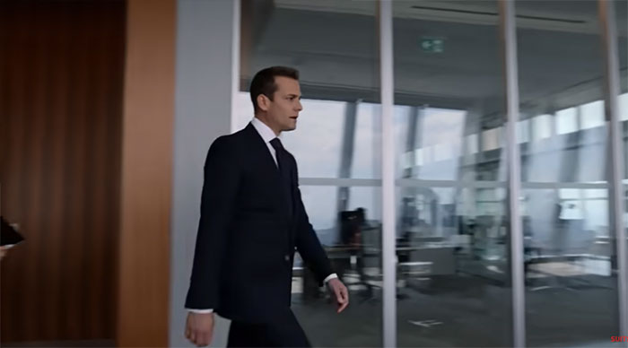 Harvey Specter walking in the office