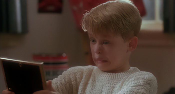 Kevin McCallister looking at picture from Home Alone