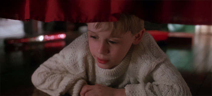 Kevin McCallister lying under the bed from Home Alone