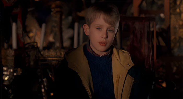 Kevin McCallister looking and wearing winter clothes from Home Alone