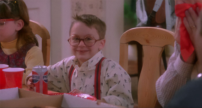 Fuller sitting looking and smiling from Home Alone
