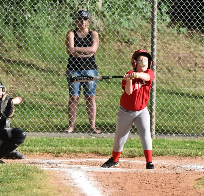 Little League Baseball. Look For The Ball. It Is Moving Across His Face, Not Toward His Nose