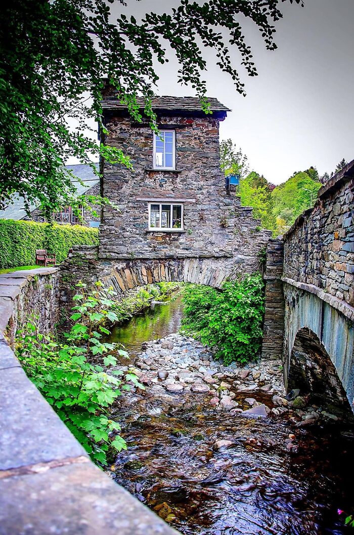 Among All The Varying Façades Of Ambleside Sits The Bridge House