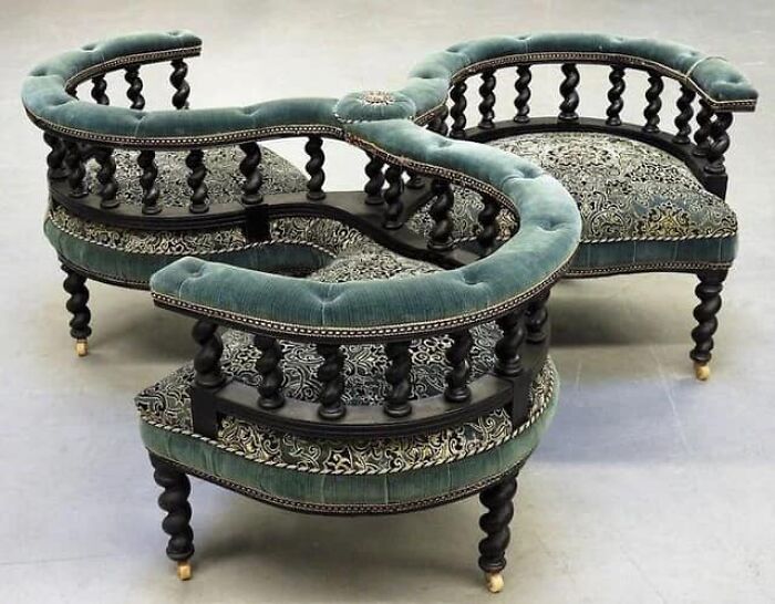 Victorian Courting Conversation Chair, Europe 19th Century. Three Tub Back Chair With Fine Turned Wood Spindles Over Finely Turned Legs Ending In Castor Wheels Upholster In Deep Green And Botanical Velvet