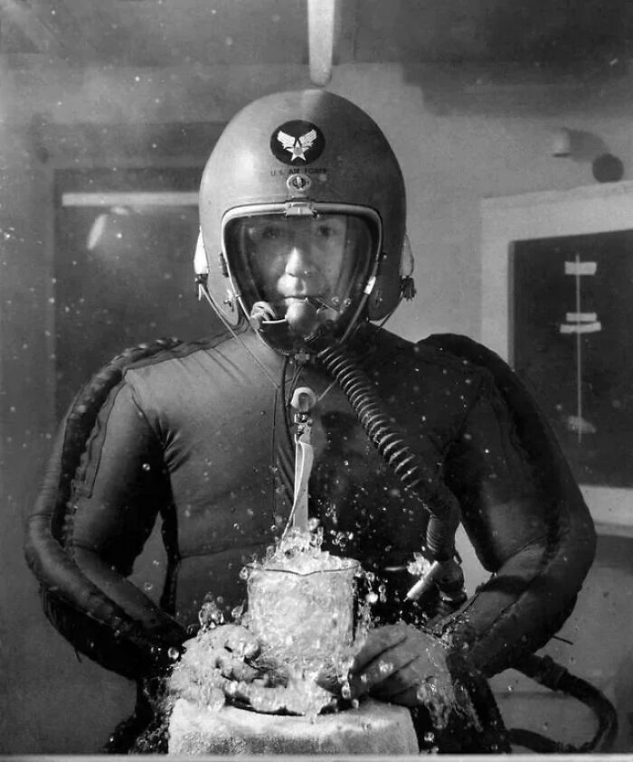 Man In A Pressure Suit With A Beaker Of Boiling Water In A Vacuum Chamber Simulating An Altitude Of 65,000 Feet, Feb. 8, 1953