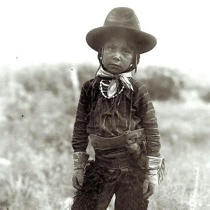 Handsome Young Crow Boy Dressed Up In Sheepskin Chaps And Fringed Gloves, Circa 1910. Photo By Richard Throssel