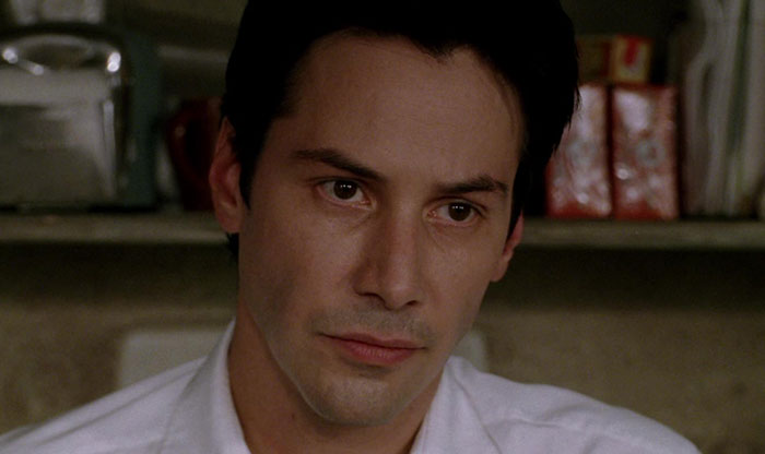 Keanu Reeves wearing white shirt