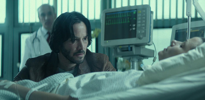 Keanu Reeves wearing brown jacket