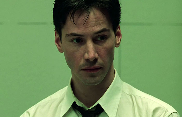 Keanu Reeves wearing white shirt