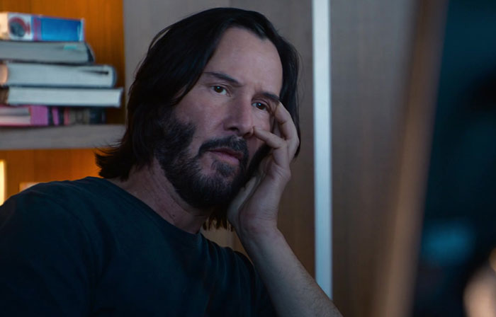 Keanu Reeves wearing black shirt