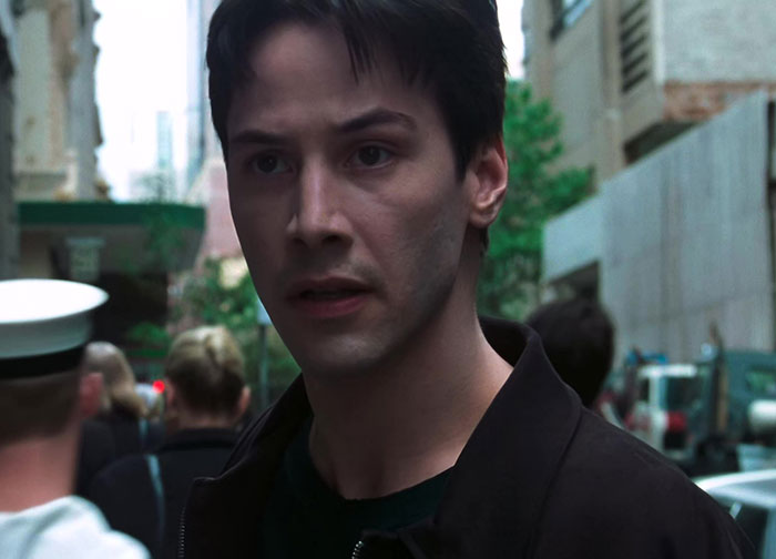 Keanu Reeves wearing brown jacket