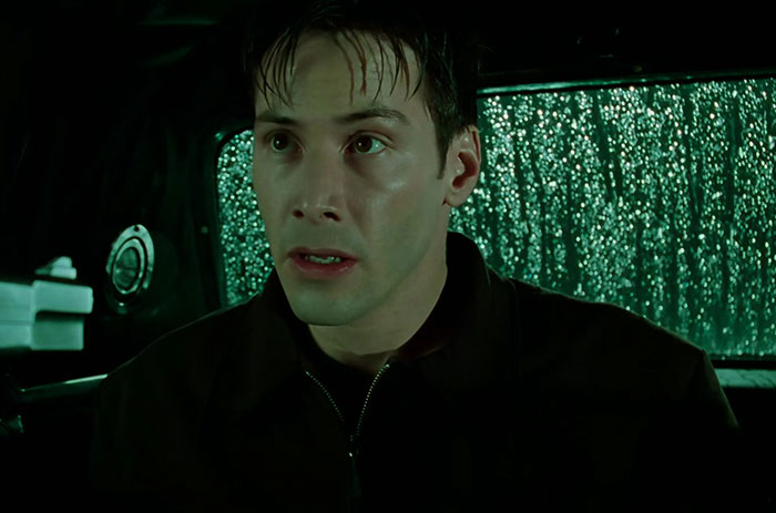 Keanu Reeves wearing black hoodie