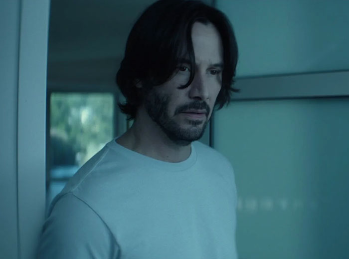 Keanu Reeves wearing white shirt