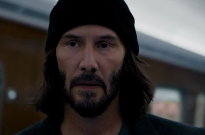 Keanu Reeves wearing hat