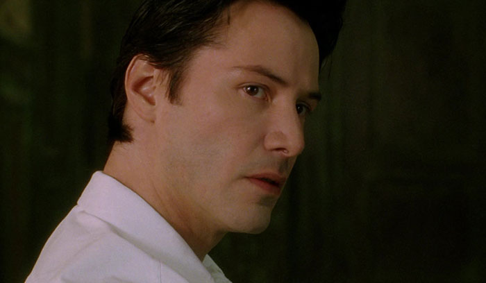 Keanu Reeves wearing white shirt
