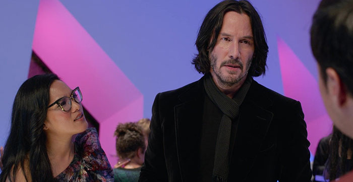 Keanu Reeves wearing black jacket
