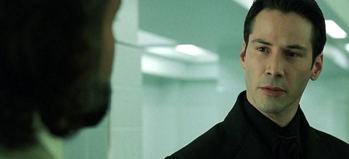 Keanu Reeves wearing black suit