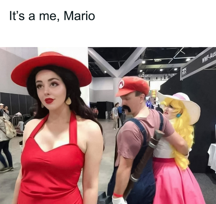 A man dressed up like Mario is walking with a woman dressed up like a Princess and looking at a woman dressed up like Pauline character