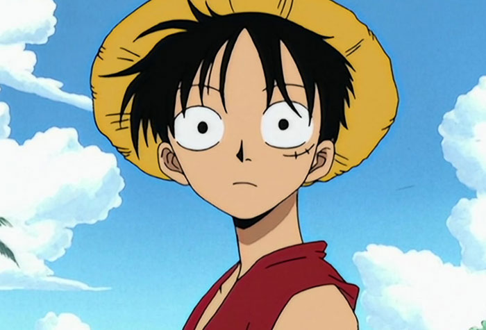 Monkey D. Luffy wearing red shirt and yellow hat