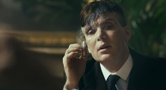 Tommy Shelby smoking a cigarette