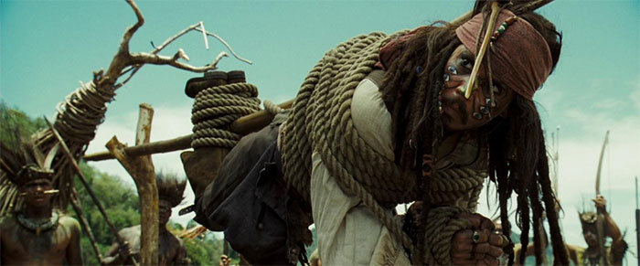 Jack Sparrow tied up to a branch 