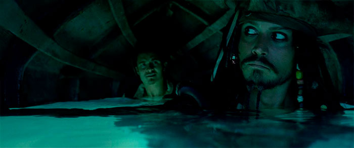 Will Turner and Jack Sparrow under a boat in water 