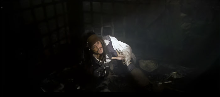 Jack Sparrow lit up in the dark room 