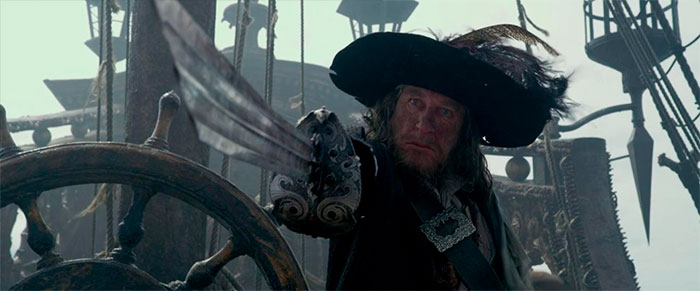 Hector Barbossa pointing his sword