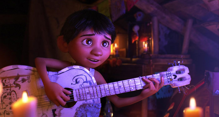 Ernesto playing a guitar