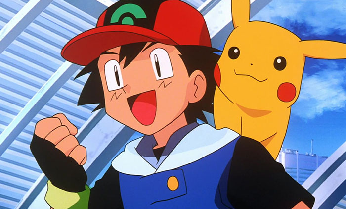 Ash Ketchum is excited, and Pikachu is on his back 