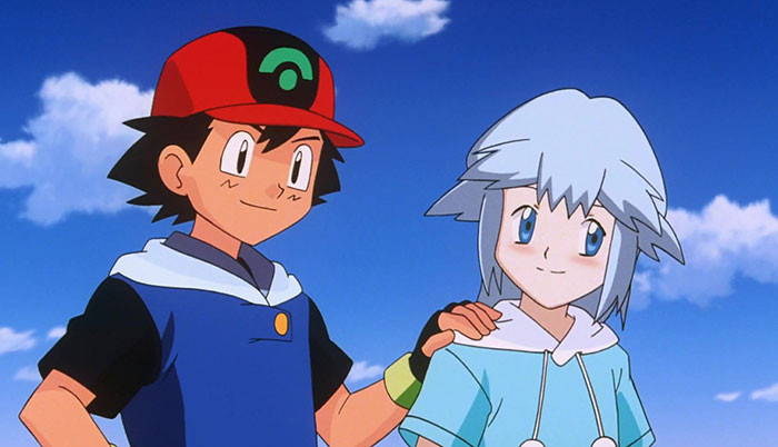 Ash Ketchum placed his hand on Tory Lund's shoulder, and the blue sky with clouds in the background