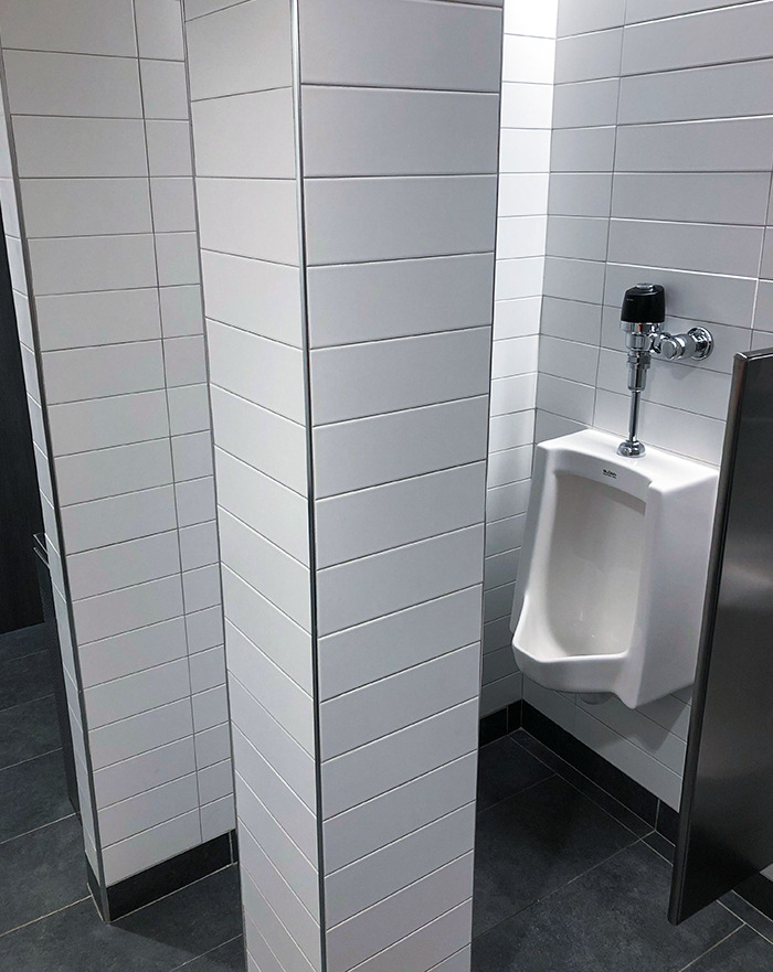 Structural Post In Front Of Urinal