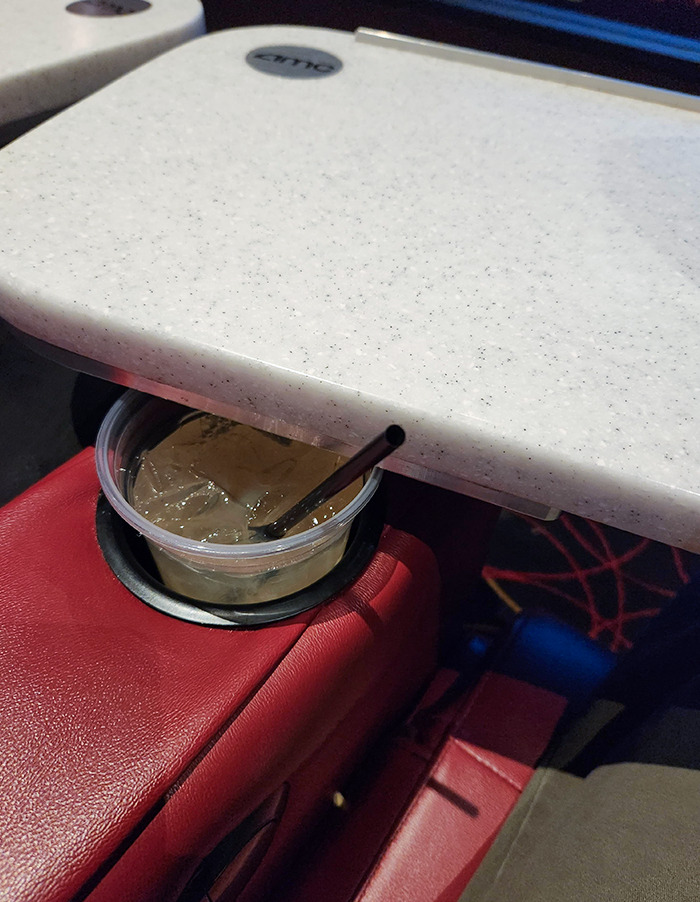 The Swivel Trays At This Movie Theater Blocks The Cup Holders